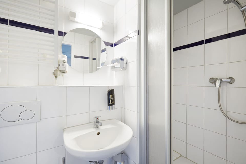 Shower, eco-friendly toiletries, hair dryer, soap