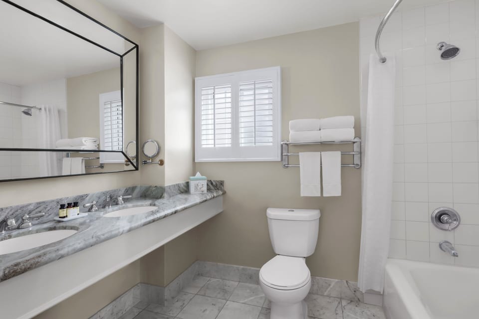 Combined shower/tub, designer toiletries, hair dryer, bathrobes
