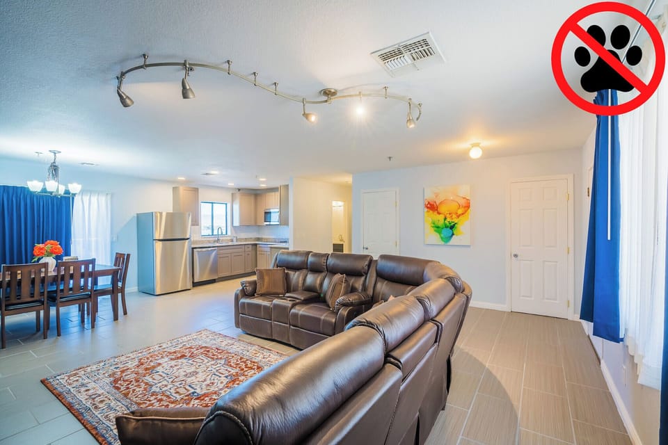 Family Apartment | Living area | 50-inch TV with satellite channels