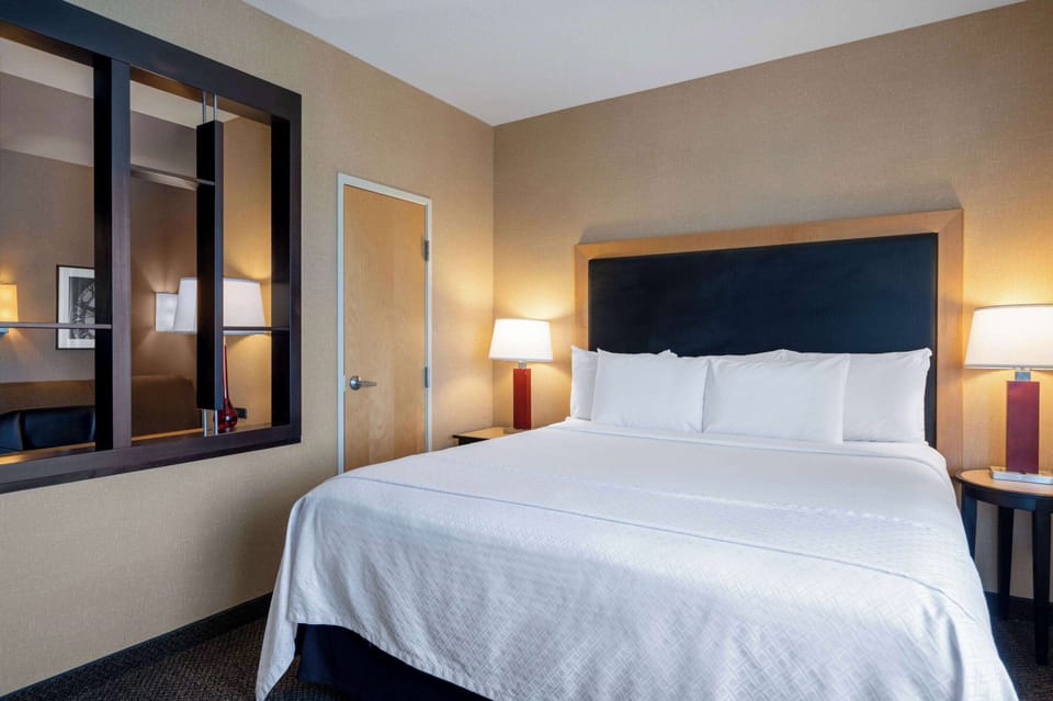 Suite, Multiple Beds, Non Smoking (1 King Bed & 1 Queen Bed) | Desk, laptop workspace, blackout drapes, iron/ironing board