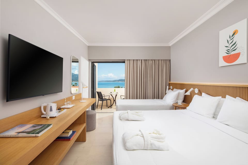Double or Twin Room, Sea View | Minibar (free items), in-room safe, desk, blackout drapes