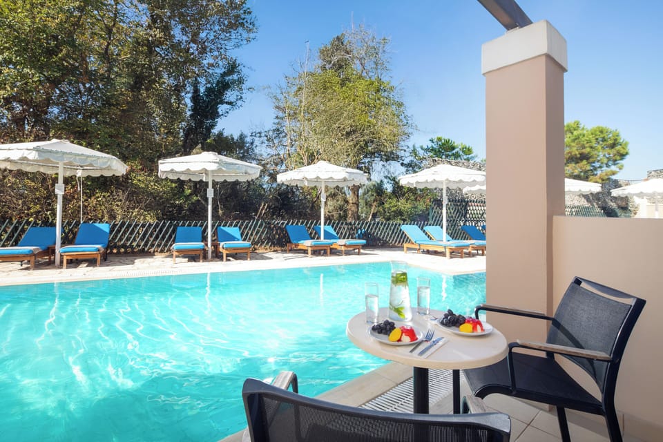 Double or Twin Room (Sharing Pool) | Free minibar, in-room safe, desk, blackout drapes