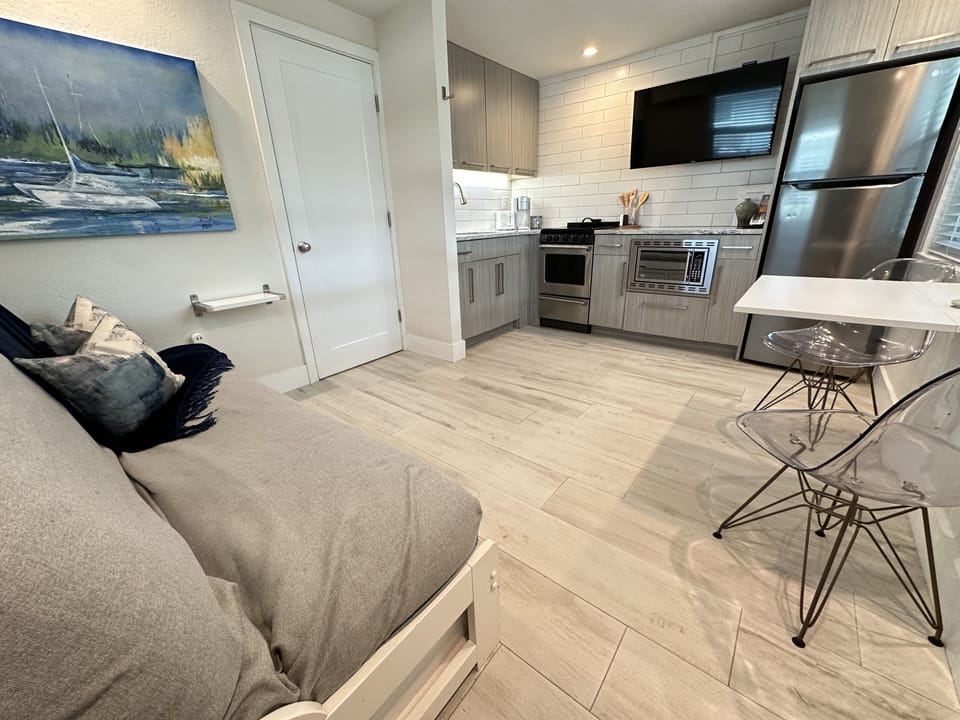 Fully stocked kitchen with quartz countertops and stainless appliances