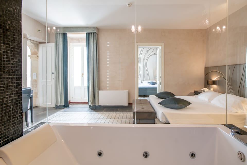 Family Quadruple Room | In-room safe, desk, blackout drapes, iron/ironing board