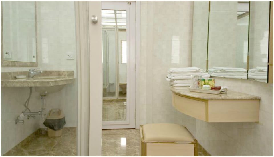 Shower, free toiletries, hair dryer, slippers
