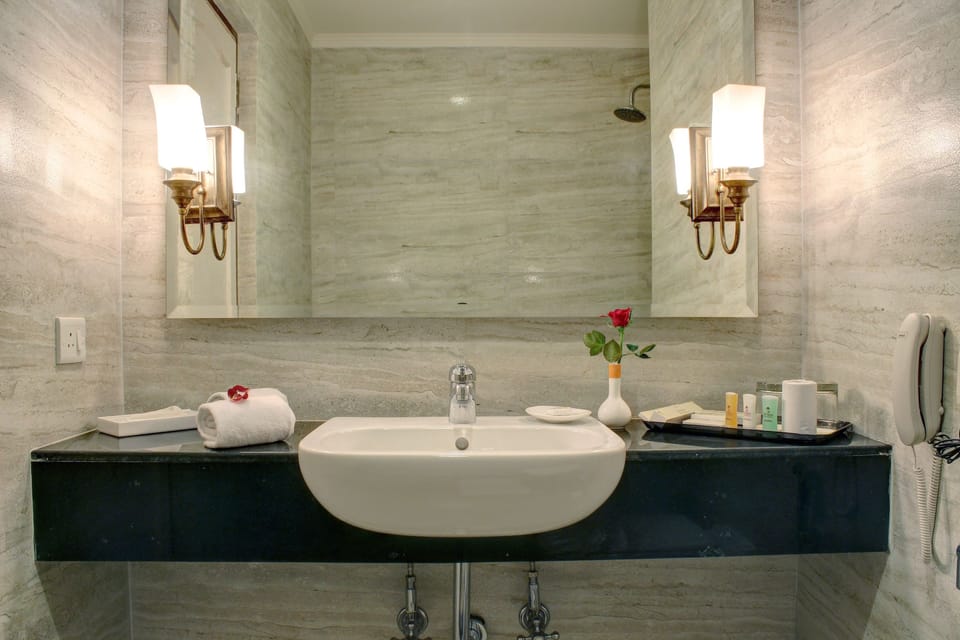 Lotus Room King Bed | Bathroom | Shower, rainfall showerhead, free toiletries, hair dryer