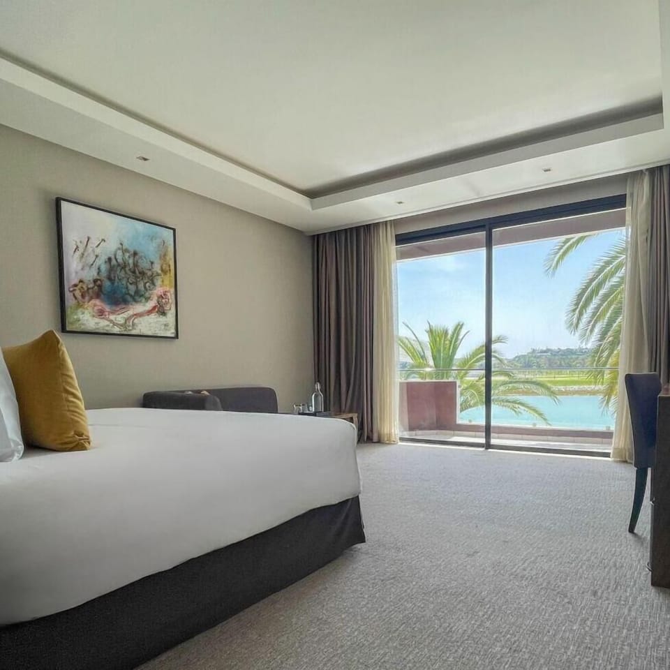 Premium Room (River View) | Minibar, in-room safe, individually decorated, individually furnished