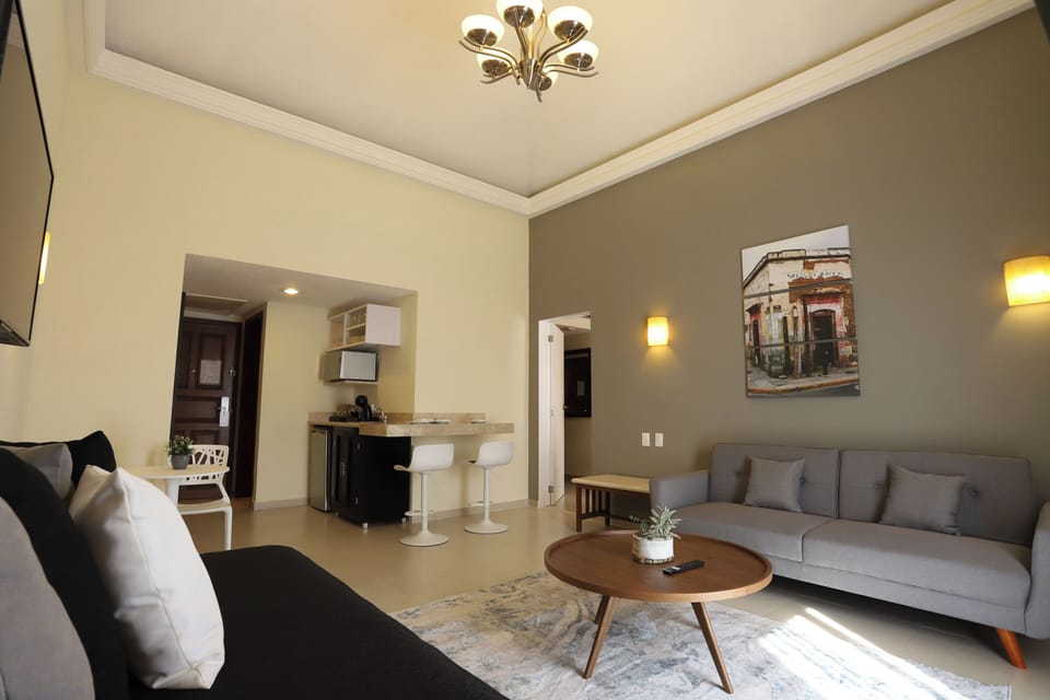 Suite, 1 Bedroom | Living area | 16-inch LCD TV with cable channels, TV