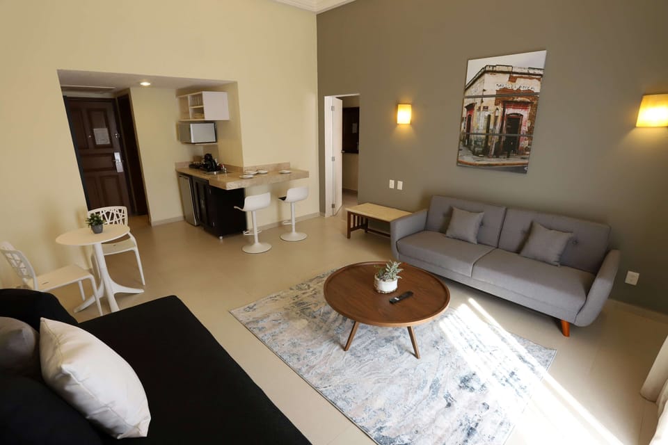 Suite, 1 Bedroom | Living area | 16-inch LCD TV with cable channels, TV