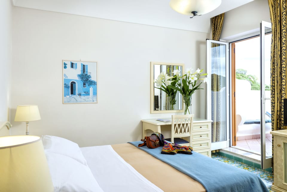 Superior Double Room, Terrace, Sea View | Minibar, in-room safe, desk, travel crib