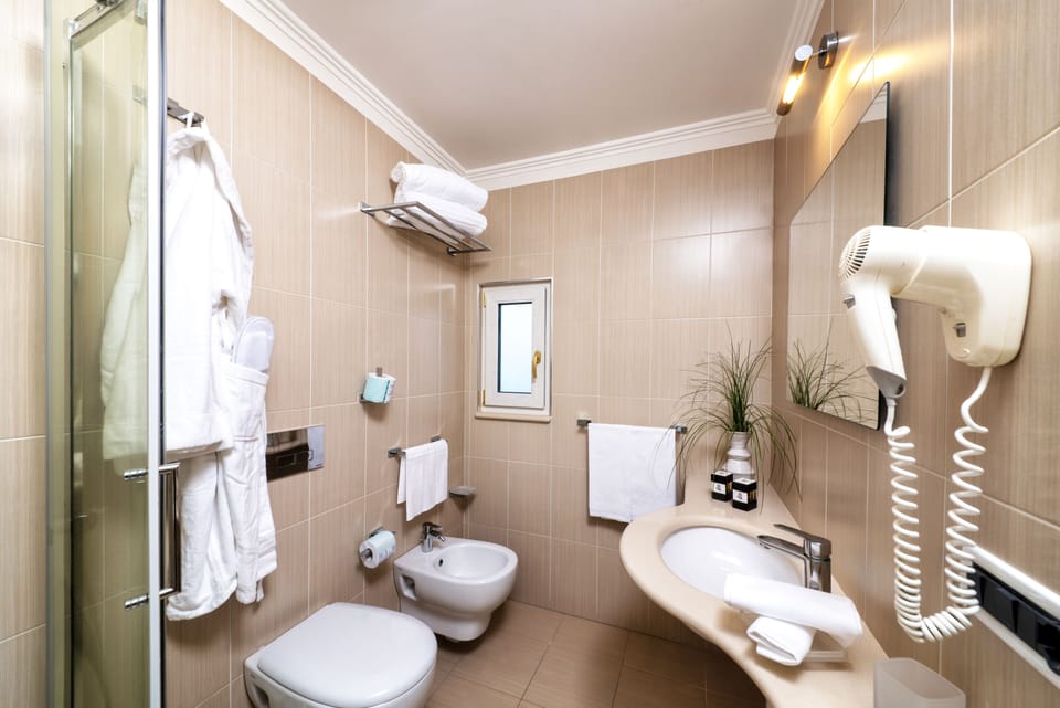 Shower, rainfall showerhead, eco-friendly toiletries, slippers