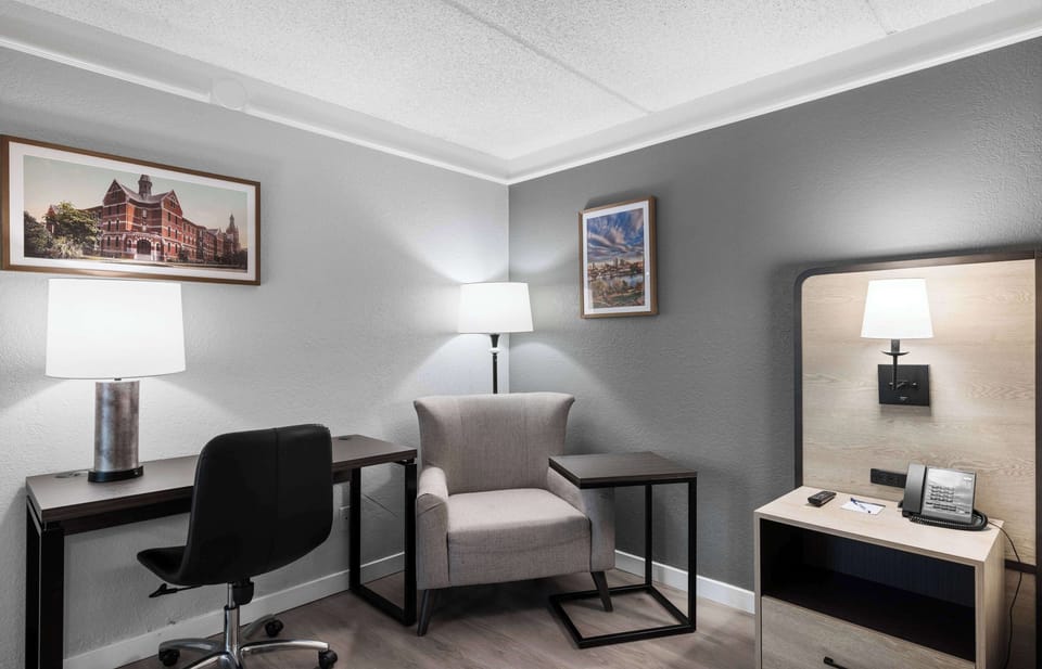 Premium bedding, desk, laptop workspace, blackout drapes