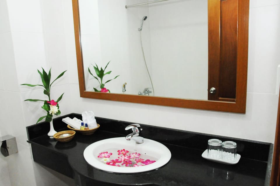 Combined shower/tub, designer toiletries, hair dryer, bathrobes