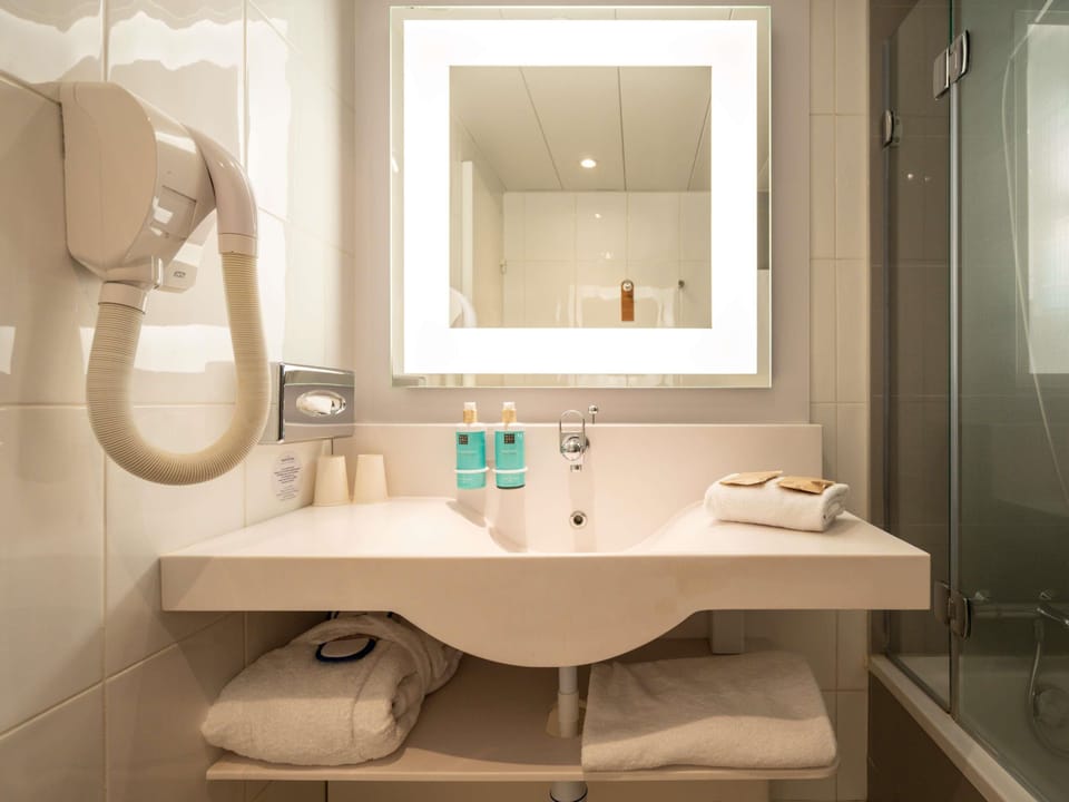 Eco-friendly toiletries, hair dryer, towels, soap