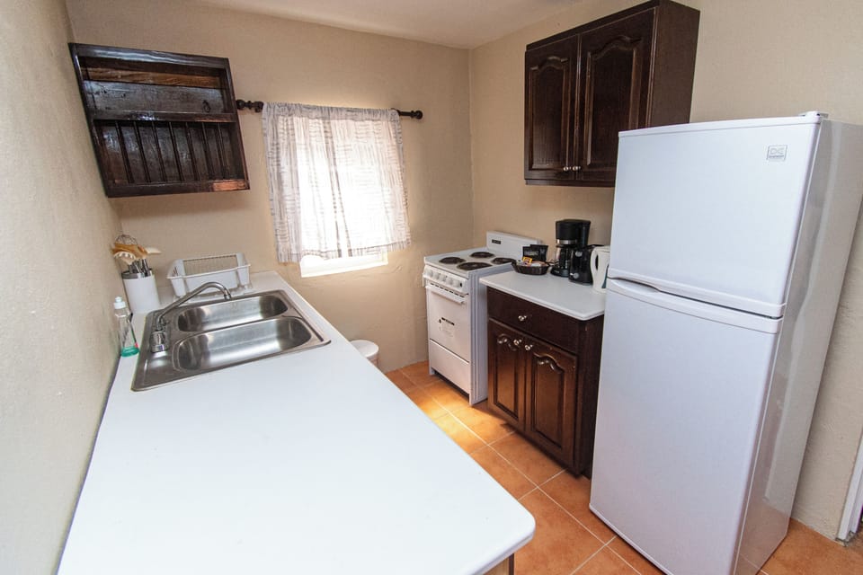 Cottage, 1 Queen Bed with Sofa bed, Balcony, Beach View (Admiral's) | Private kitchen | Coffee/tea maker, fridge