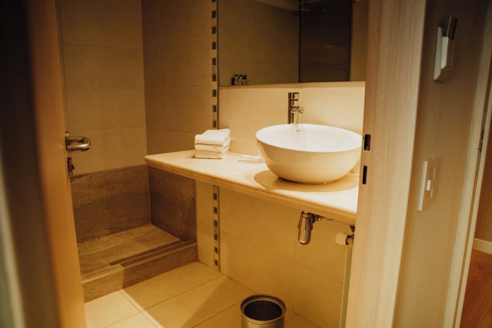 Bathtub, deep soaking tub, eco-friendly toiletries, hair dryer