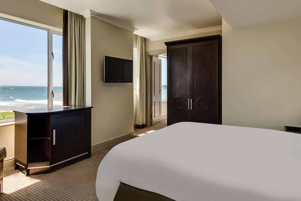Superior Two Bedroom with Partial Sea View | In-room safe, desk, laptop workspace, iron/ironing board