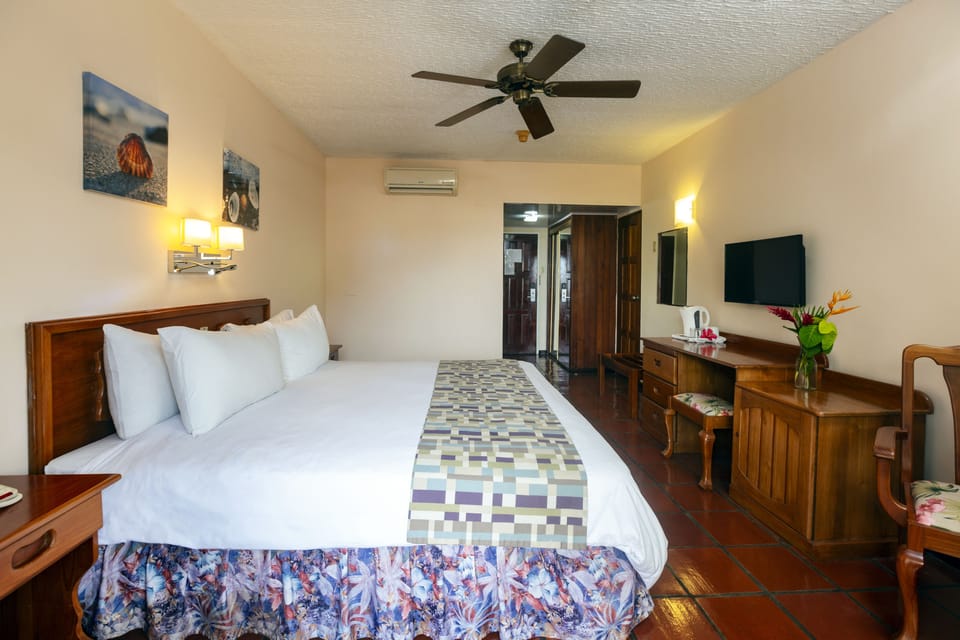 Standard Room, 1 King Bed, Garden View | Select Comfort beds, in-room safe, desk, iron/ironing board (on request)