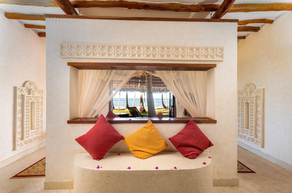 Executive Suite, Beachfront | Minibar, in-room safe, individually decorated, desk