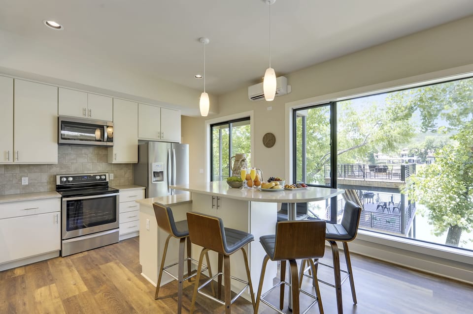 Dining Area + Kitchen - Walker Luxury Vacation Rentals