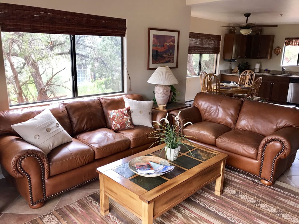 Open concept living room to kitchen and backyard.