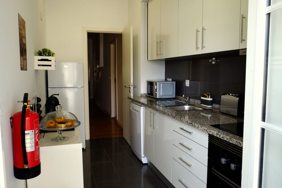 Kitchen, here you'll find a toaster, microwave, dish washer, oven, fridge, coffe