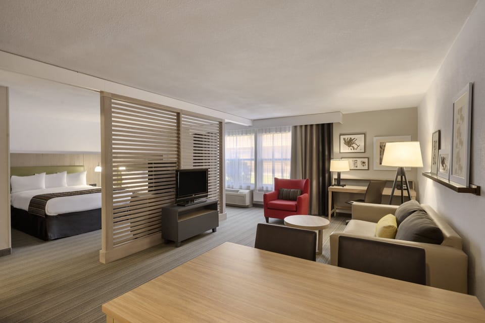 Suite, 2 Queen Beds | Desk, iron/ironing board, free cribs/infant beds, free WiFi