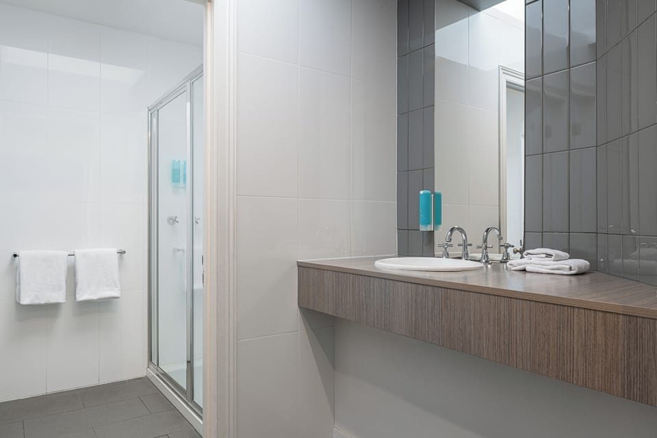 Colonial Family Room | Bathroom | Shower, hair dryer, towels, soap