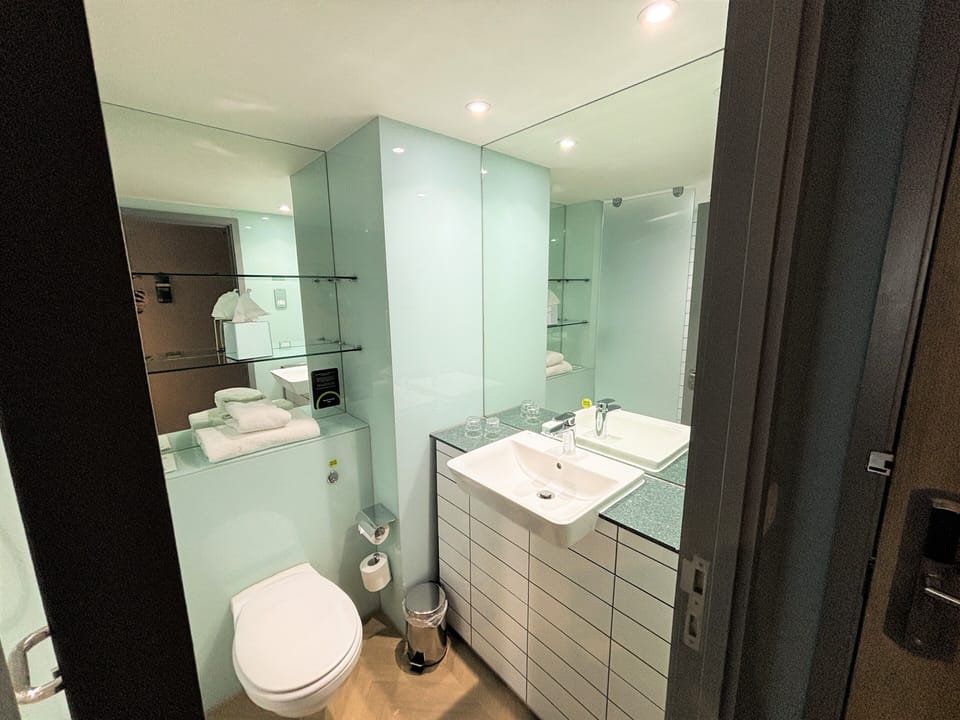Shower, rainfall showerhead, hair dryer, towels