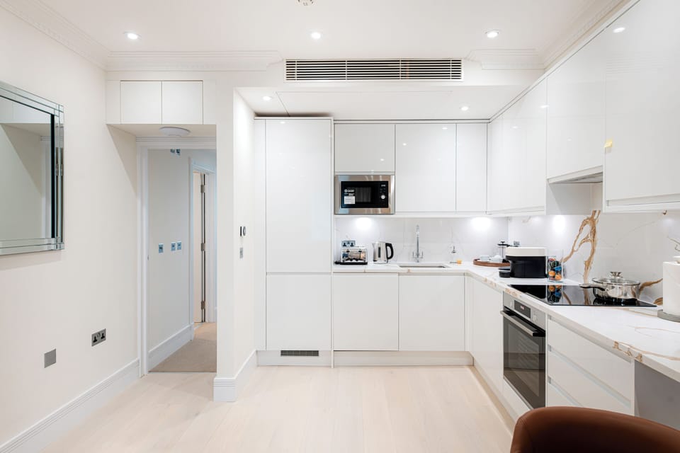 Two Bedroom Executive apartment | Private kitchen | Espresso maker, coffee/tea maker, full-size fridge, microwave