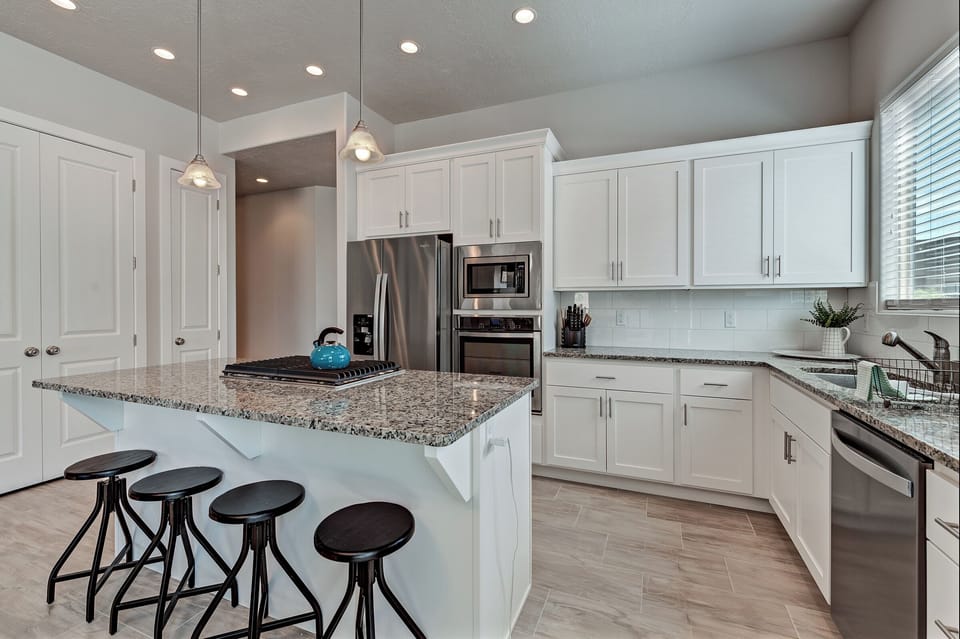 Kitchen - The Kitchen is complete with everything you will need for meal preparations including pots, pans, baking dishes, plates, cups, silverware, cutlery, and an assortment of cooking utensils.