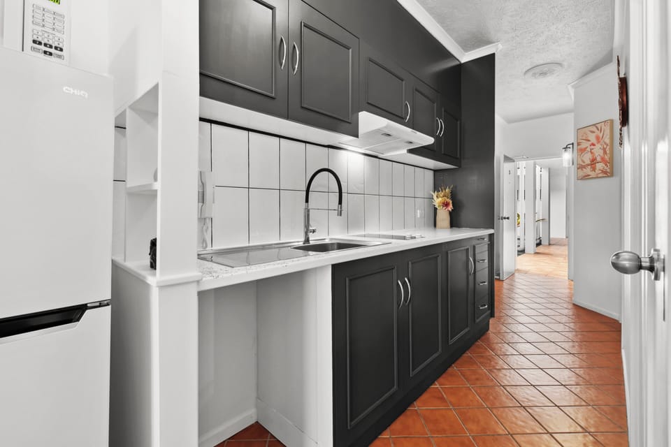 Executive Room | Private kitchen | Full-size fridge, microwave, toaster, cleaning supplies