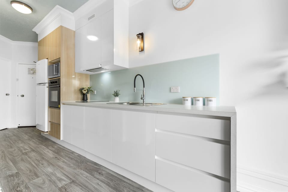 Deluxe Room | Private kitchen | Full-size fridge, microwave, toaster, cleaning supplies