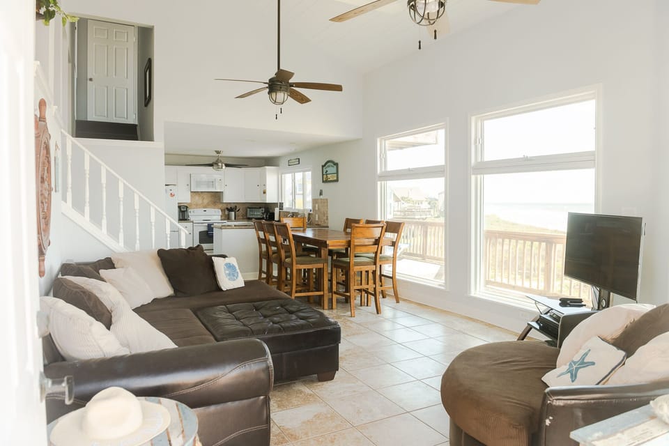 Open living and dining area with plenty of natural light and ocean views.