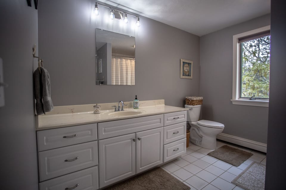 One of three bathrooms.  