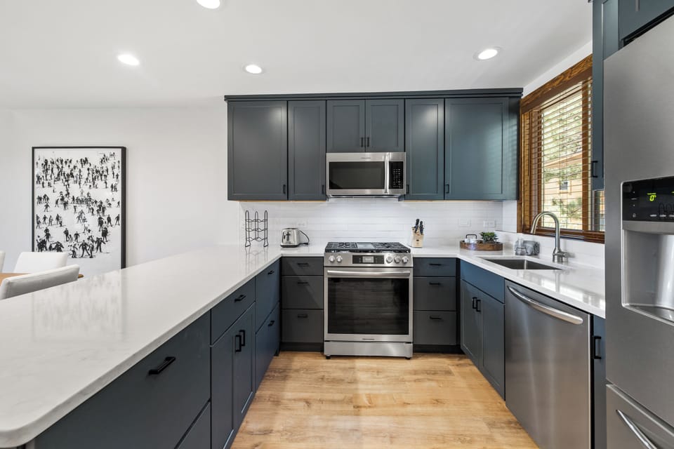 Stainless steel appliances and beautiful marble countertops