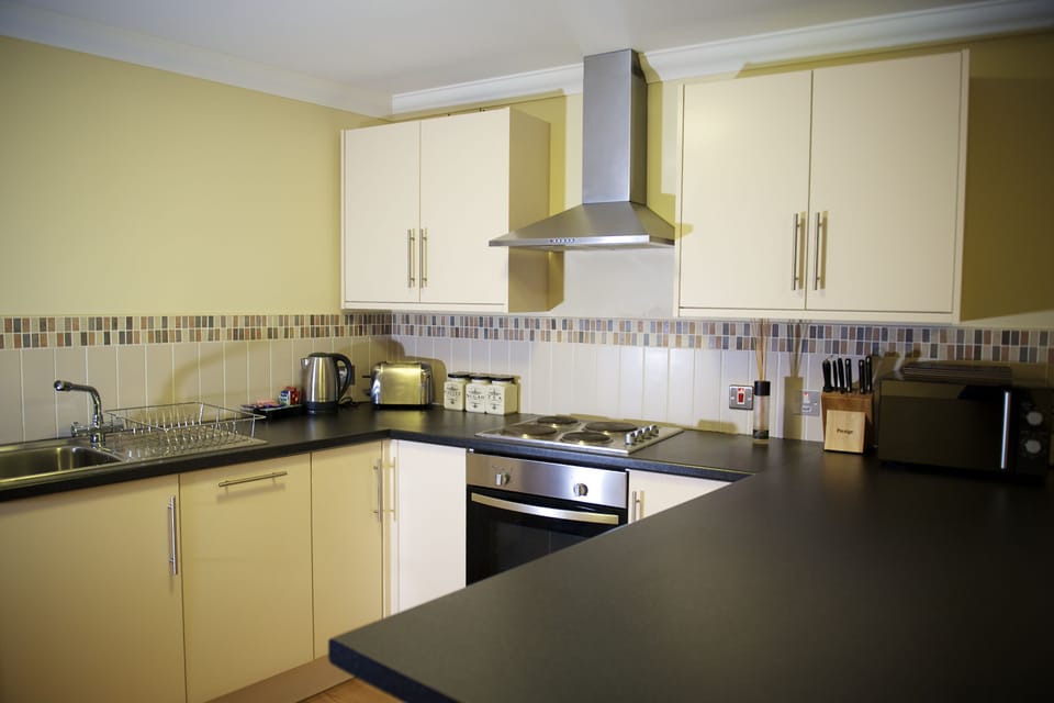 Family Apartment, 1 Bedroom | Private kitchen | Coffee/tea maker