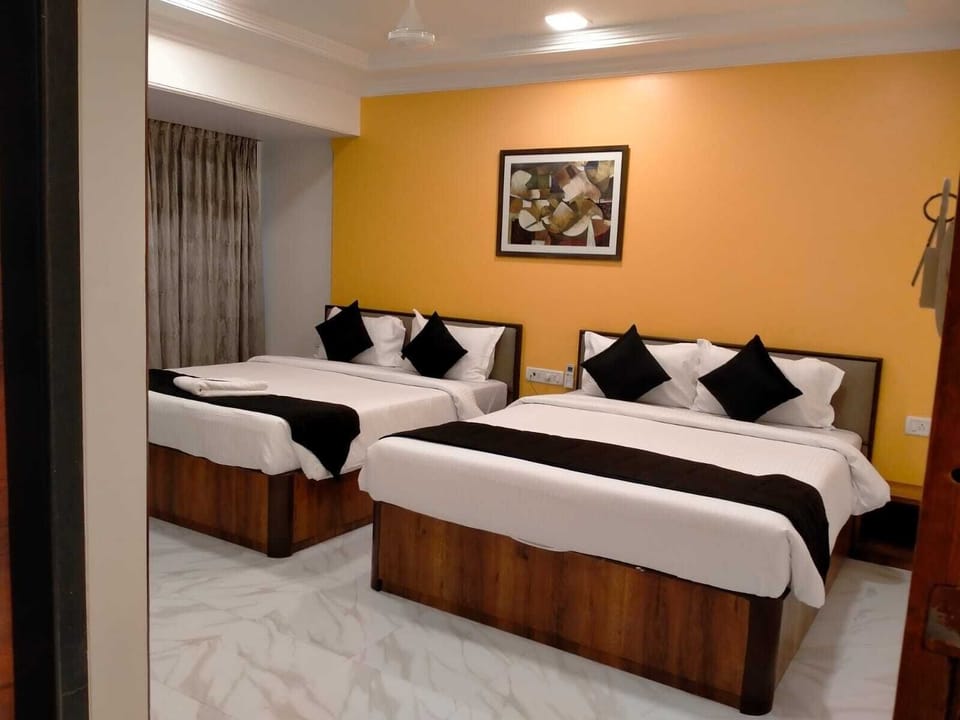 Deluxe Quadruple Room | Individually furnished, blackout drapes, iron/ironing board, free WiFi