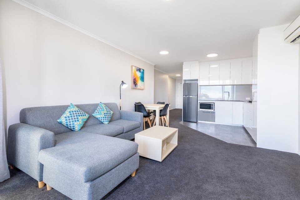 1 Bedroom with Shower | Living area | Flat-screen TV, DVD player