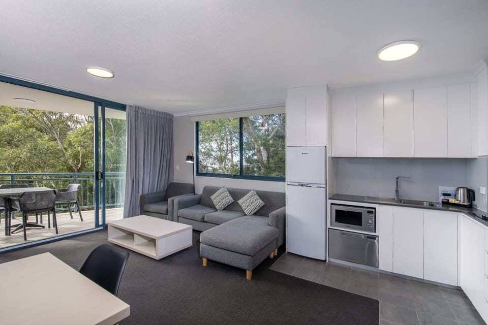 1 Bedroom with Shower | Living area | Flat-screen TV, DVD player
