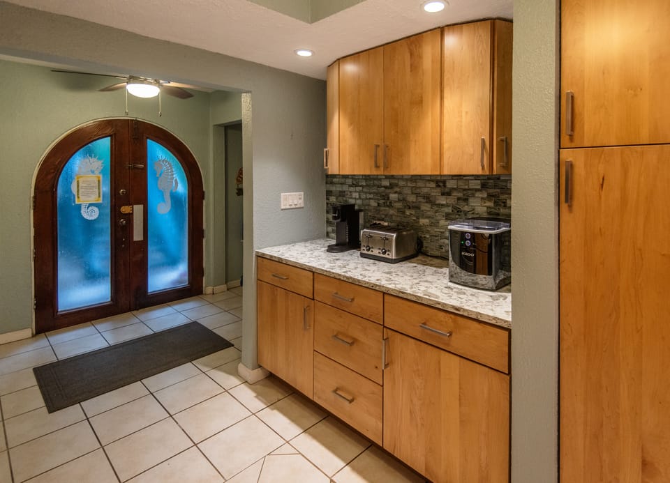 Updated Kitchen with Quartz Counters & Beach Glass Back Splash
