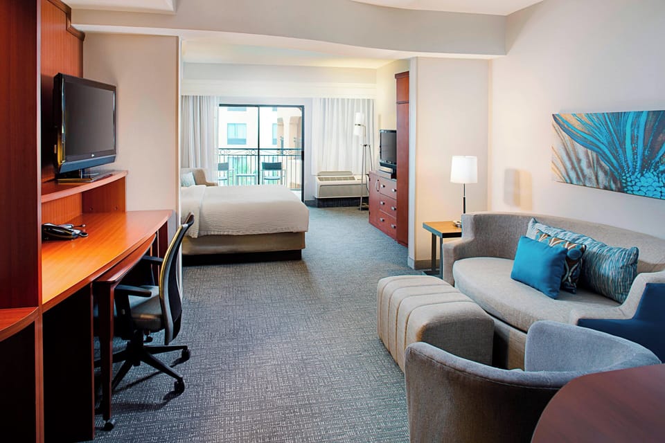 Desk, blackout drapes, iron/ironing board, free cribs/infant beds