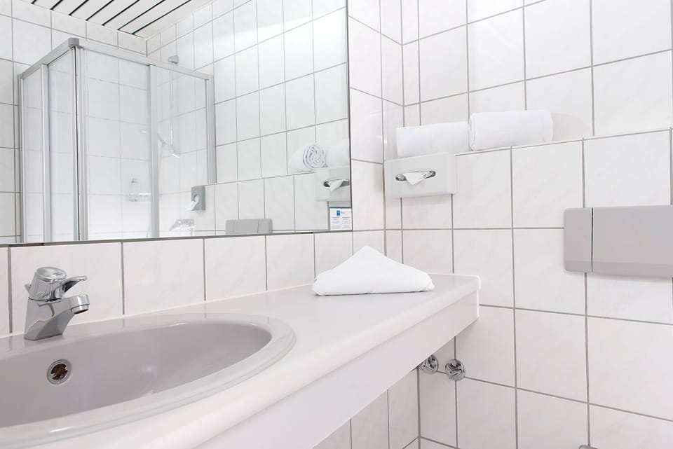 Shower, eco-friendly toiletries, hair dryer, towels