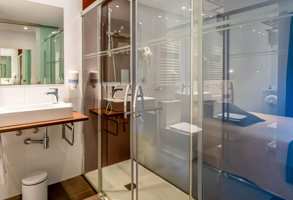 Shower, rainfall showerhead, eco-friendly toiletries, hair dryer