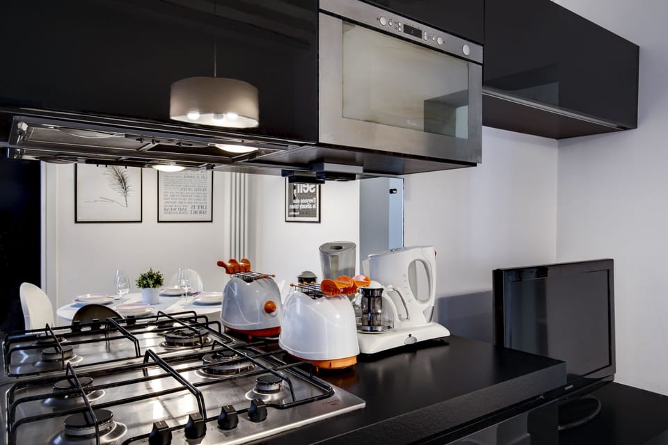Apartment, 2 Bedrooms | Private kitchen | Full-size fridge, microwave, stovetop, dishwasher