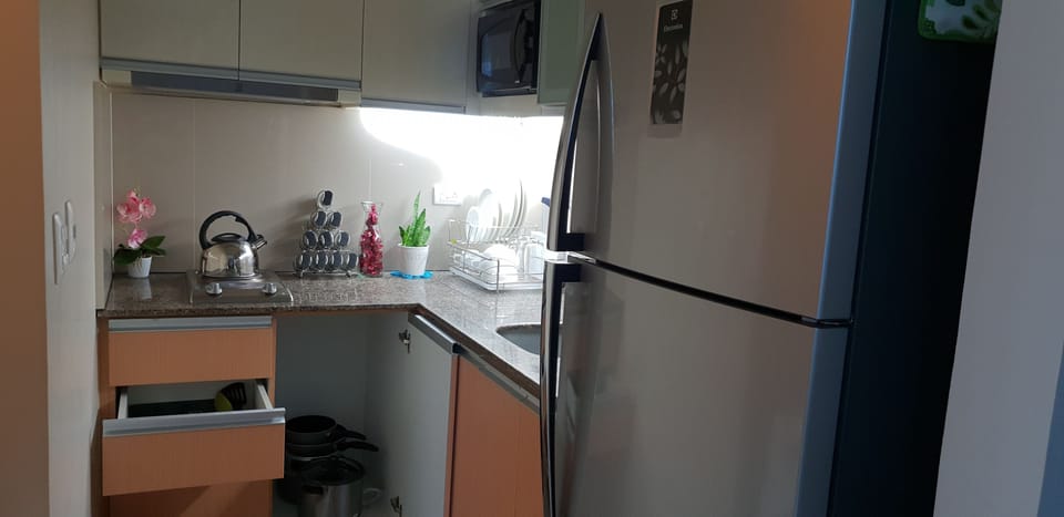 Condo, 1 Bedroom | Private kitchen | Full-size fridge, microwave, stovetop, coffee/tea maker