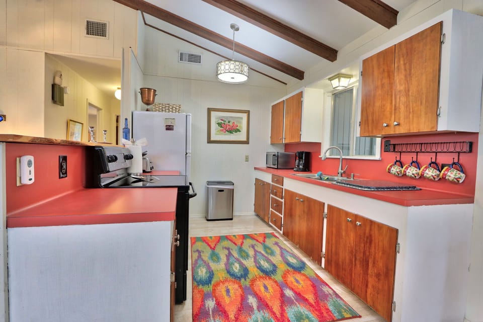 Full kitchen with stove, oven, refrigerator, microwave, and coffee maker
