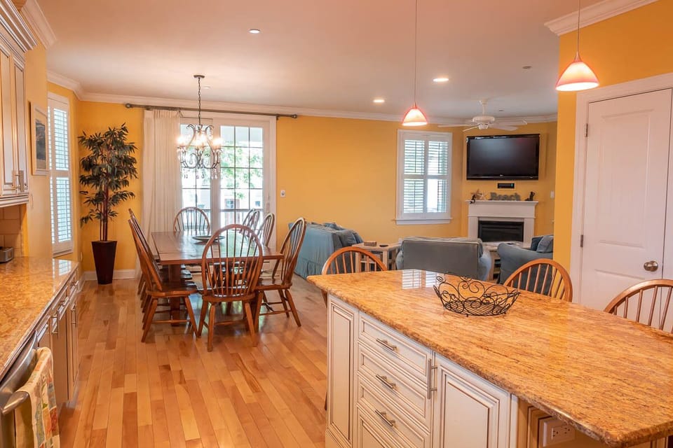 View of dining area and living room from kitchen.
