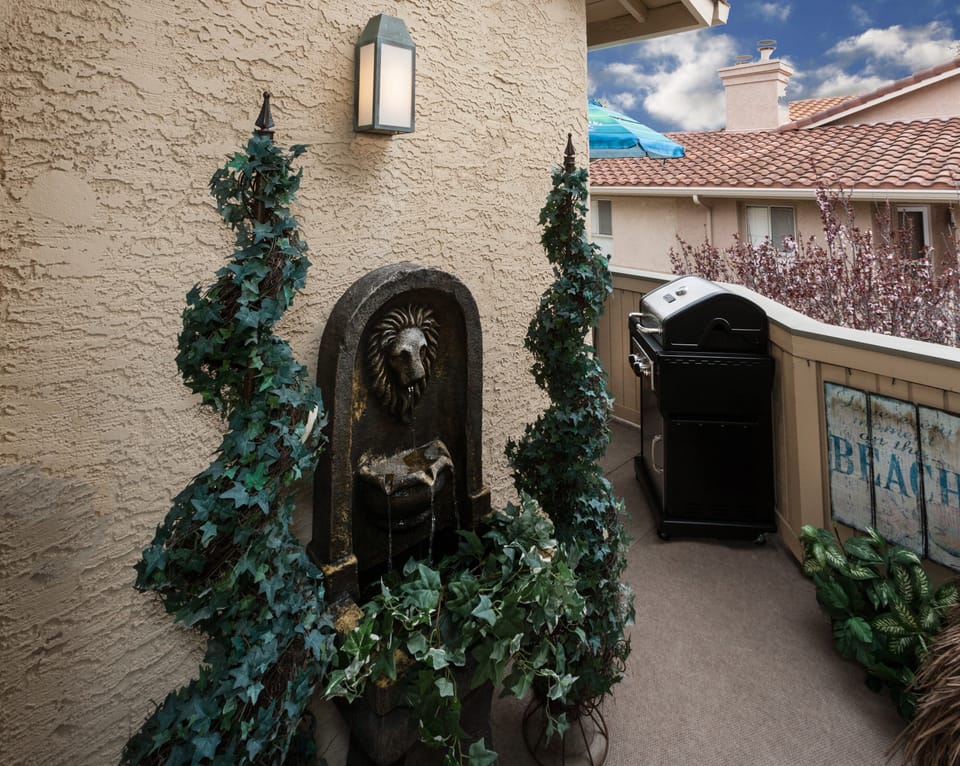 Calming fountain outside master suite  Comfy deck with gas BBQ