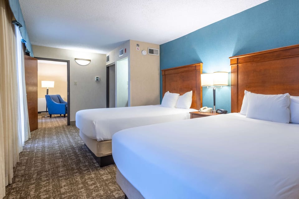 Suite, 2 Queen Beds (Sofa Sleeper, 2 Rooms) | Desk, blackout drapes, iron/ironing board, free cribs/infant beds